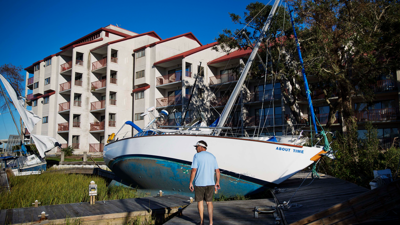 Boats sit washed up on shore amongst the twisted docks at Palmetto Bay Marina damaged by Hurricane Matthew in Hilton Head, S.C., Sunday, Oct. 9, 2016 (Image: AP)